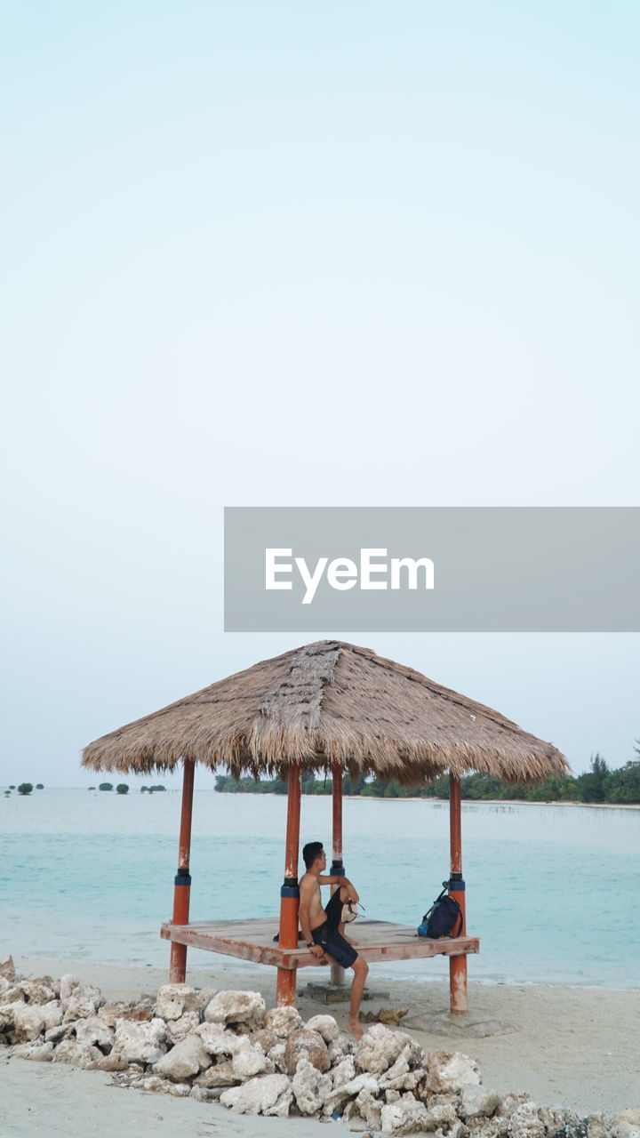 low angle view of boat in sea against clear sky