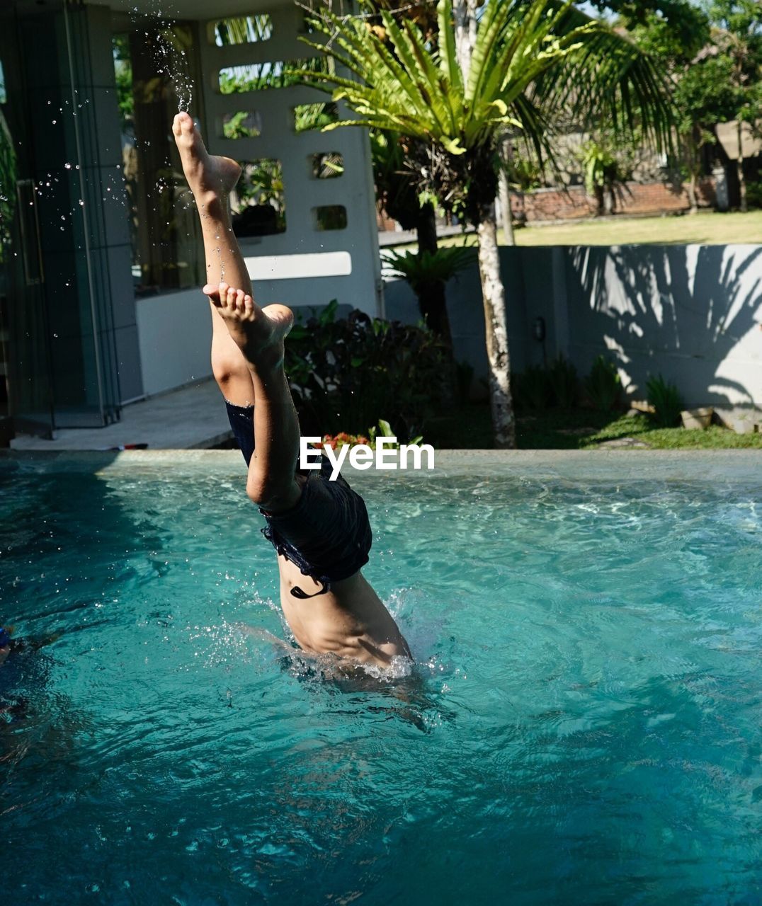 Portrait of man swimming in pool