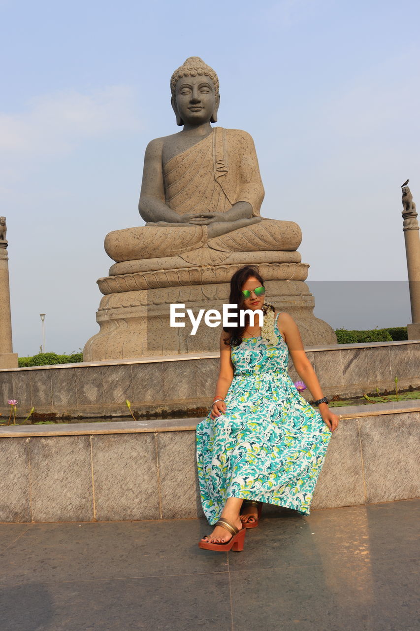 art, day, sky, nature, blue, architecture, one person, outdoors, wall, built structure, adult, building exterior, leisure activity, full length