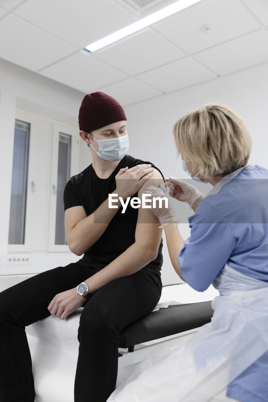 Young man getting vaccinated