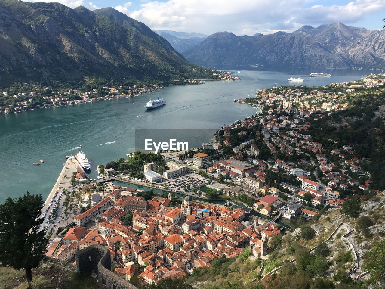 Aerial view of town by sea and mountains