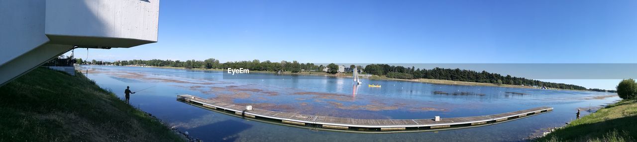 PANORAMIC VIEW OF SWIMMING POOL AGAINST SKY