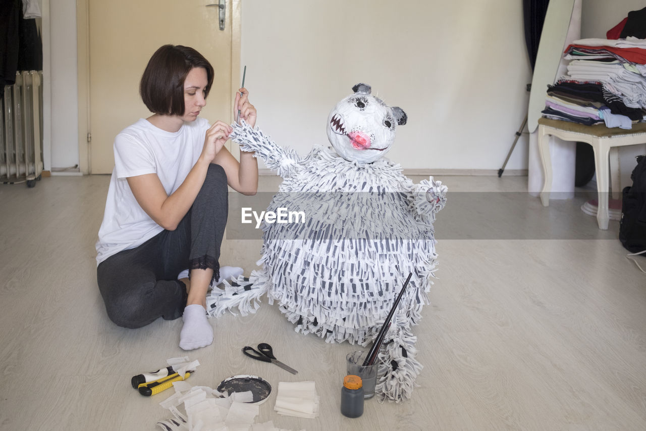 WOMEN SITTING ON FLOOR IN HOSPITAL