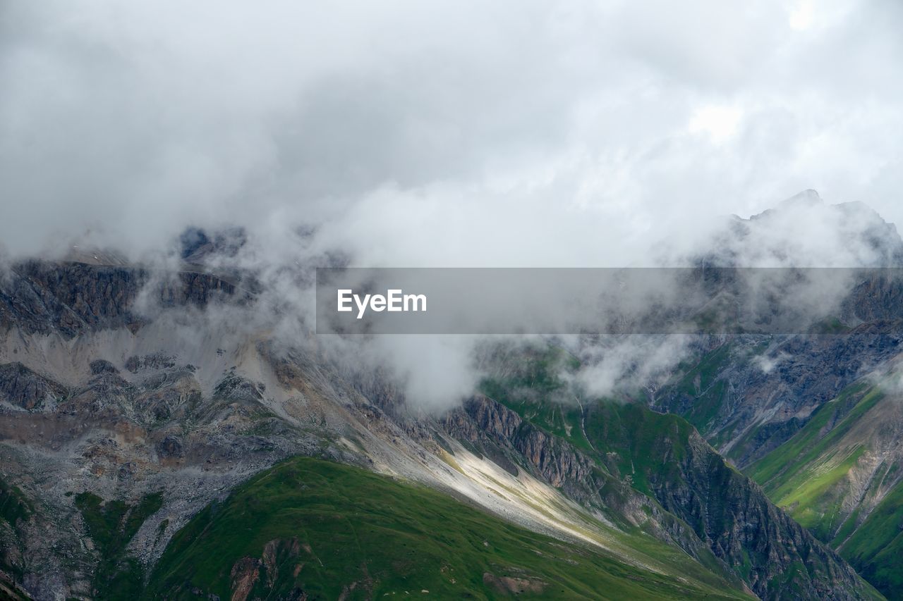 Scenic view of mountains in foggy weather