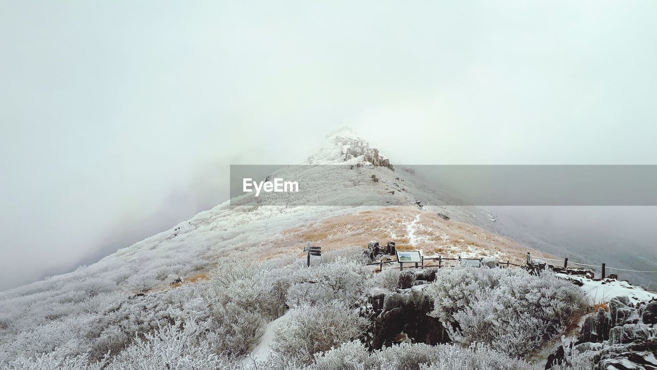 Scenic view of snowcapped mountain against sky