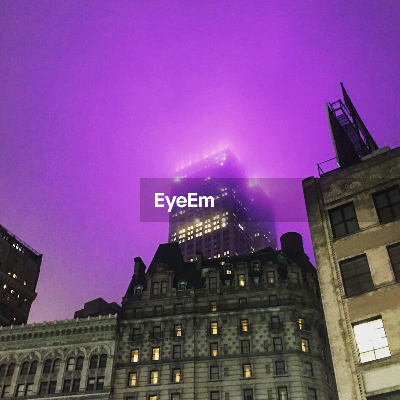 Low angle view of modern building at night