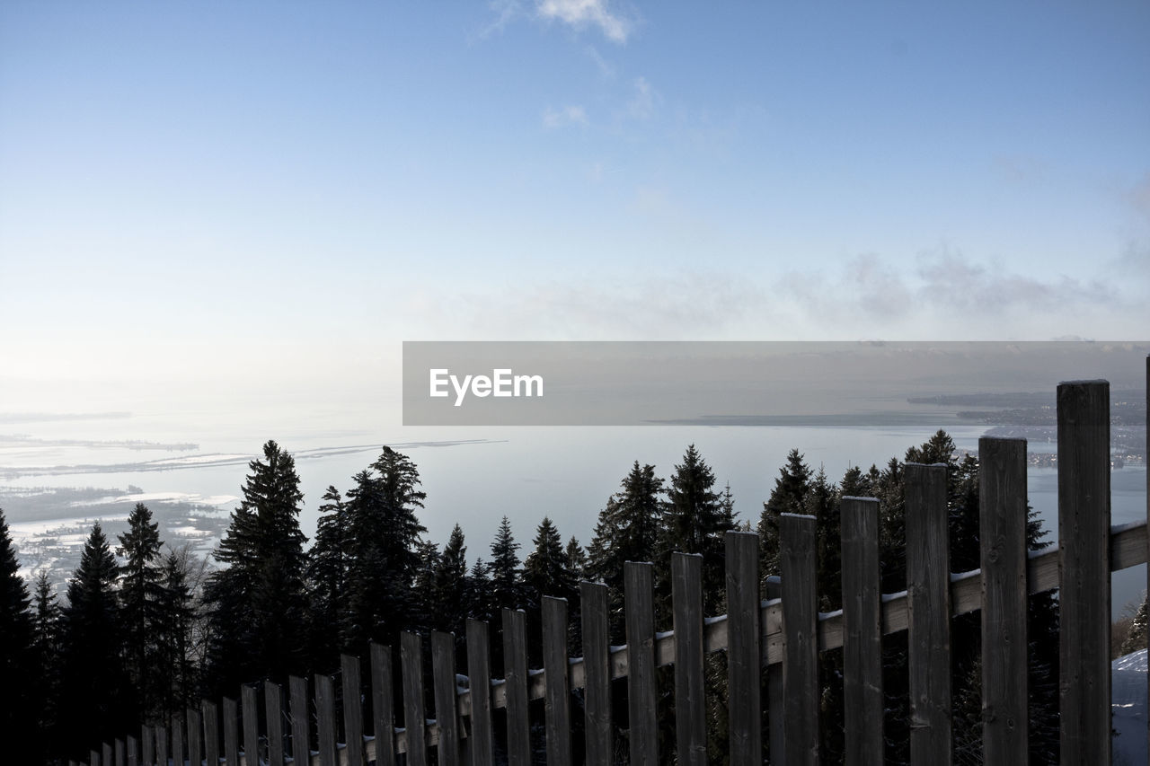 Panoramic shot of wooden fence against sky