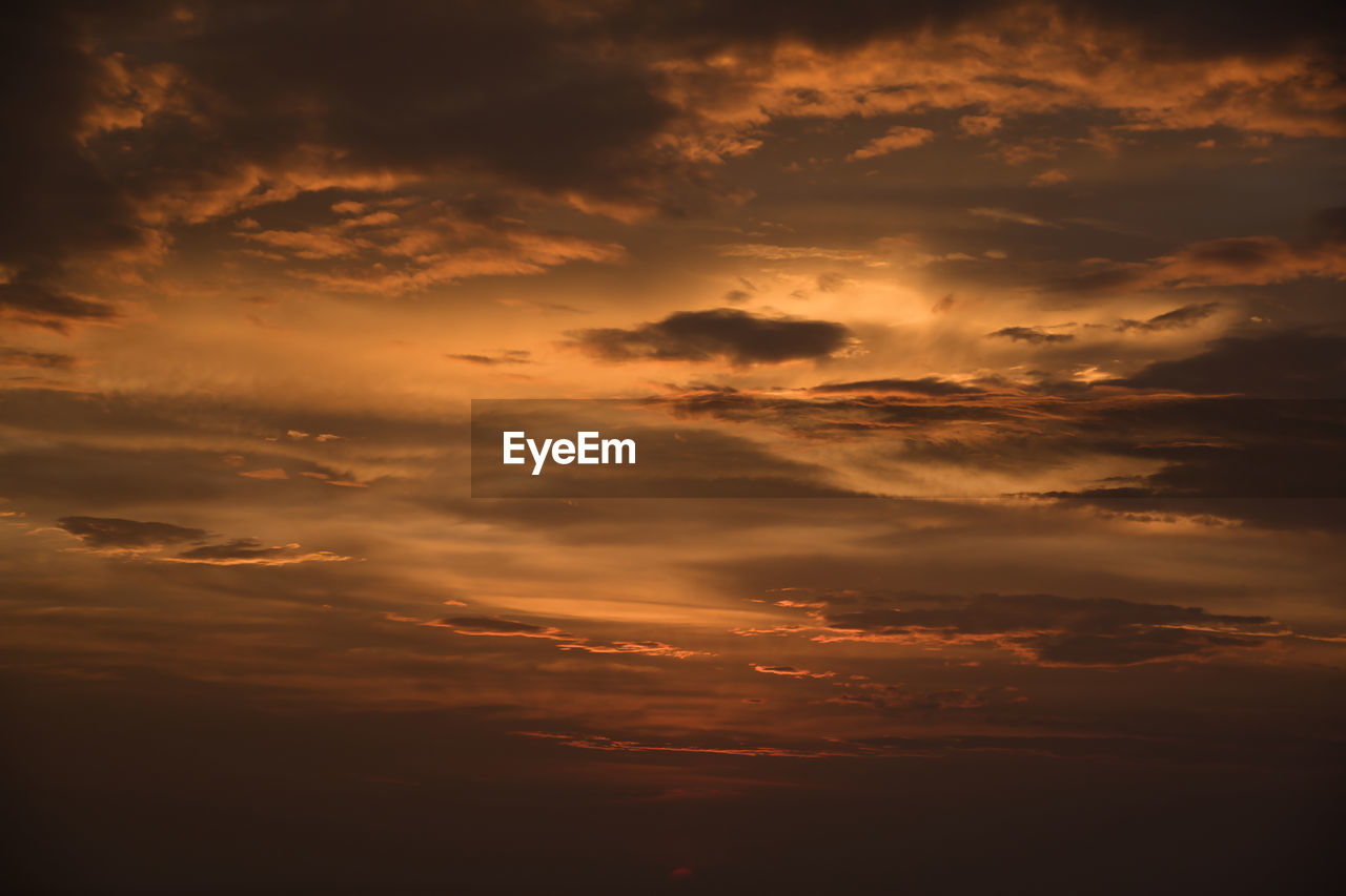 SCENIC VIEW OF DRAMATIC SKY DURING SUNSET