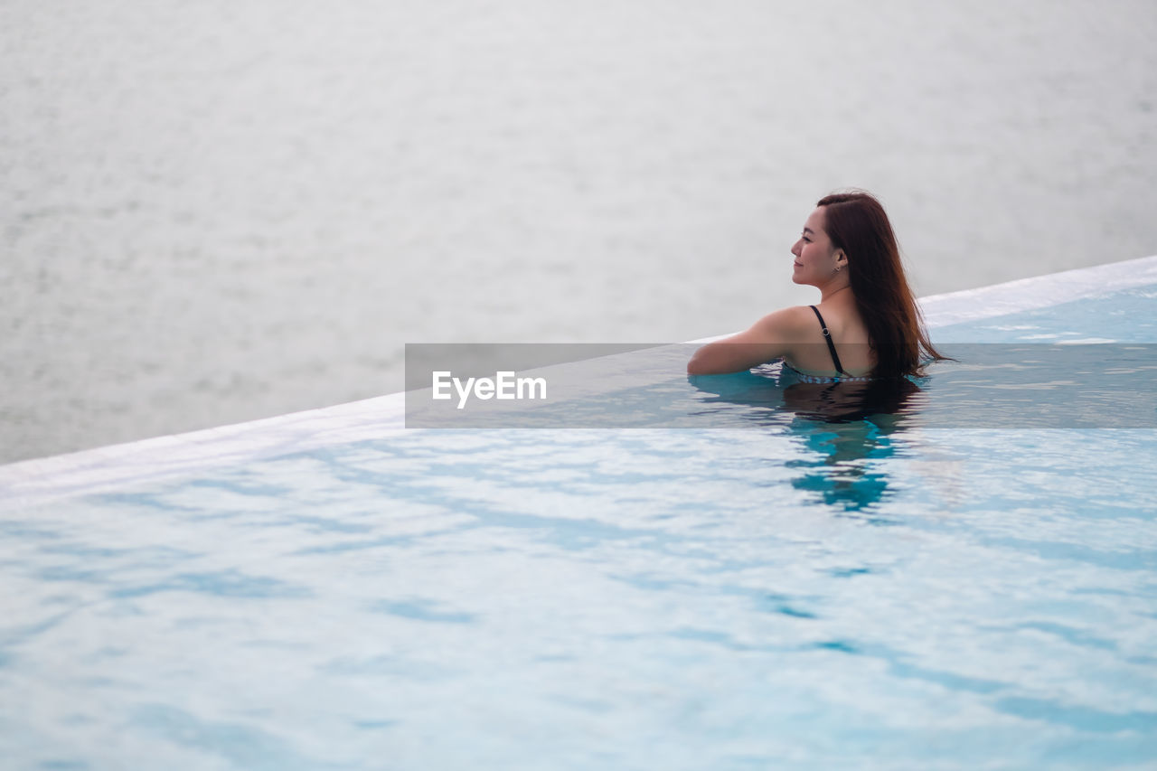 portrait of woman swimming in pool