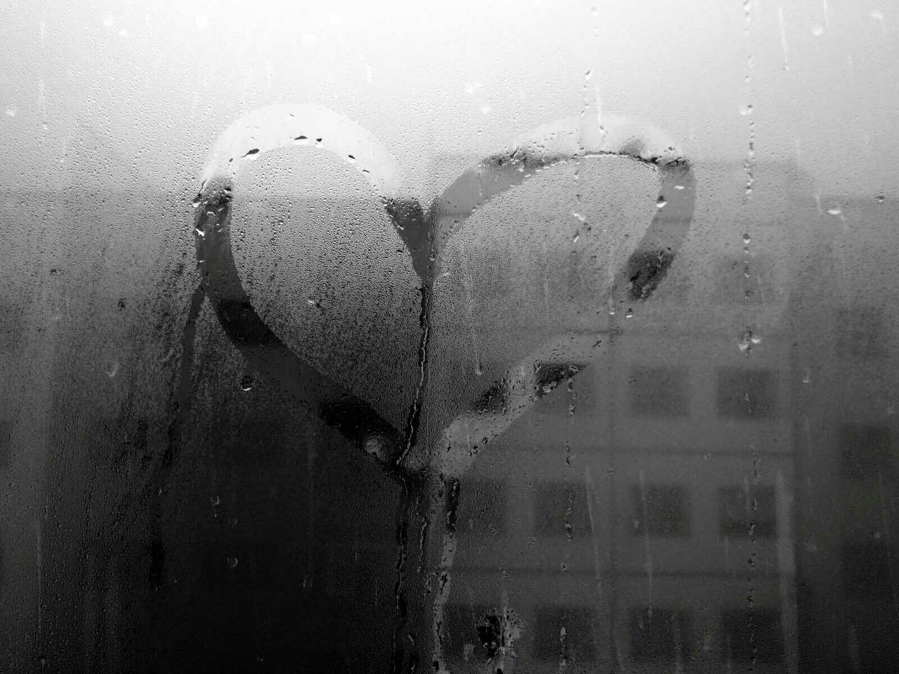 Heart shape drawn in condensation of window