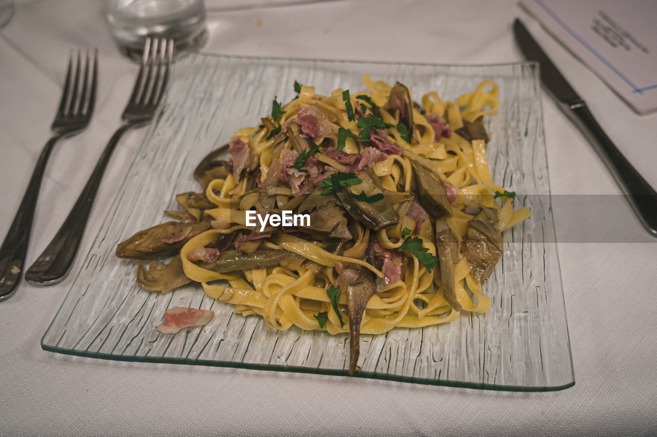 Italian tagliatelle with artichokes, cheek lard and parsley