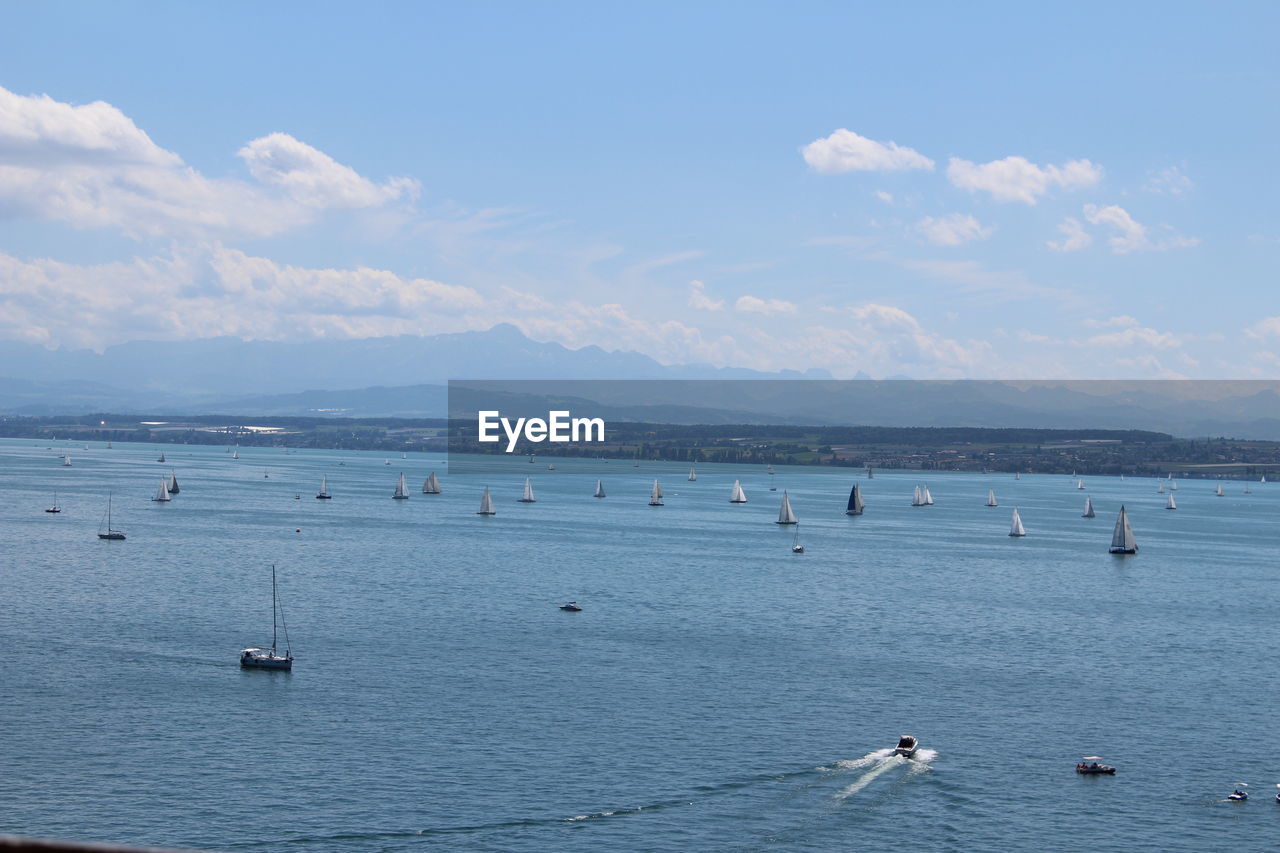 Aerial view of boats on sea against sky