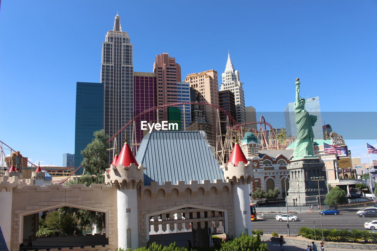 MODERN BUILDINGS AGAINST BLUE SKY