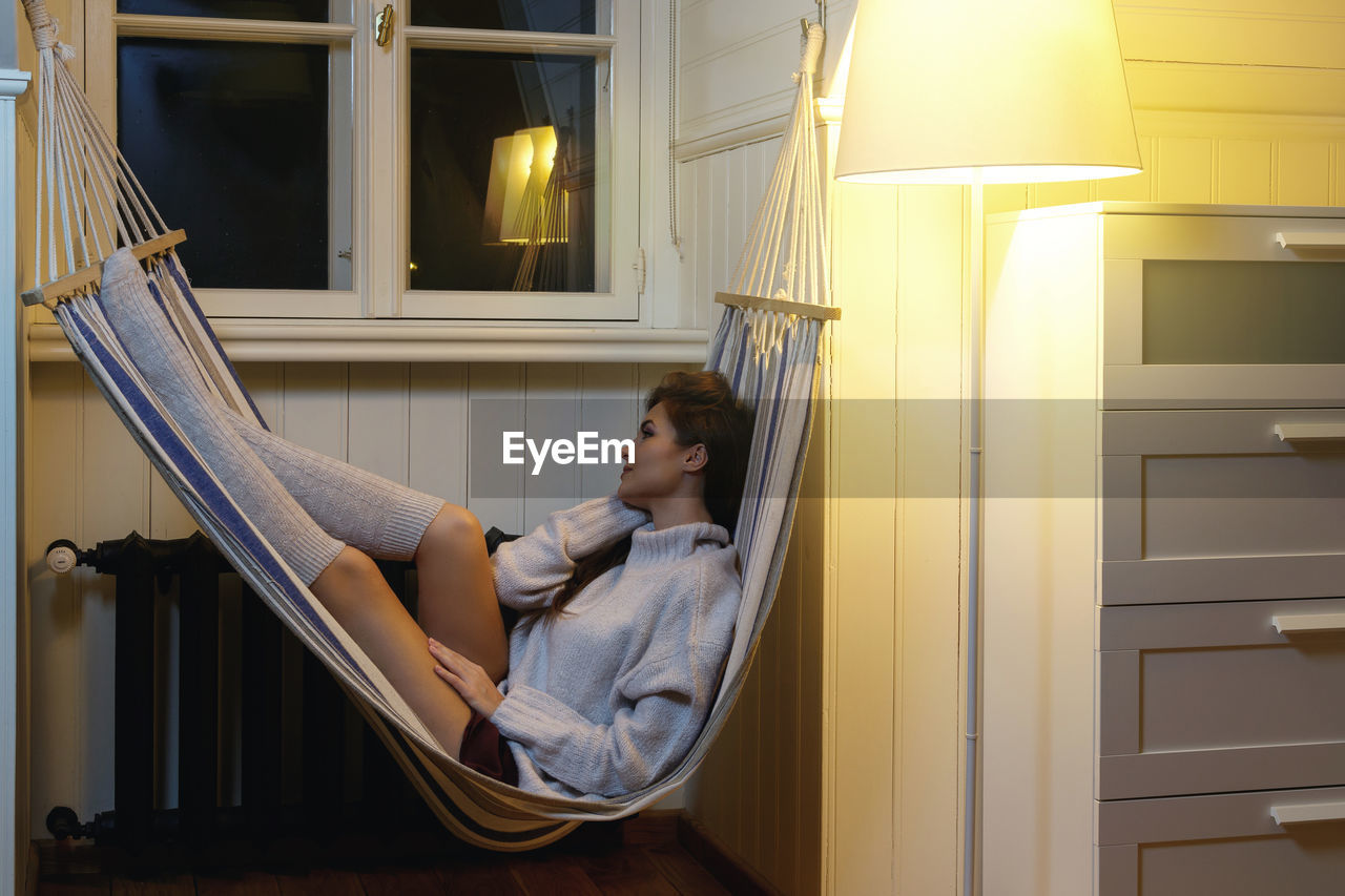 Woman relaxing on hammock