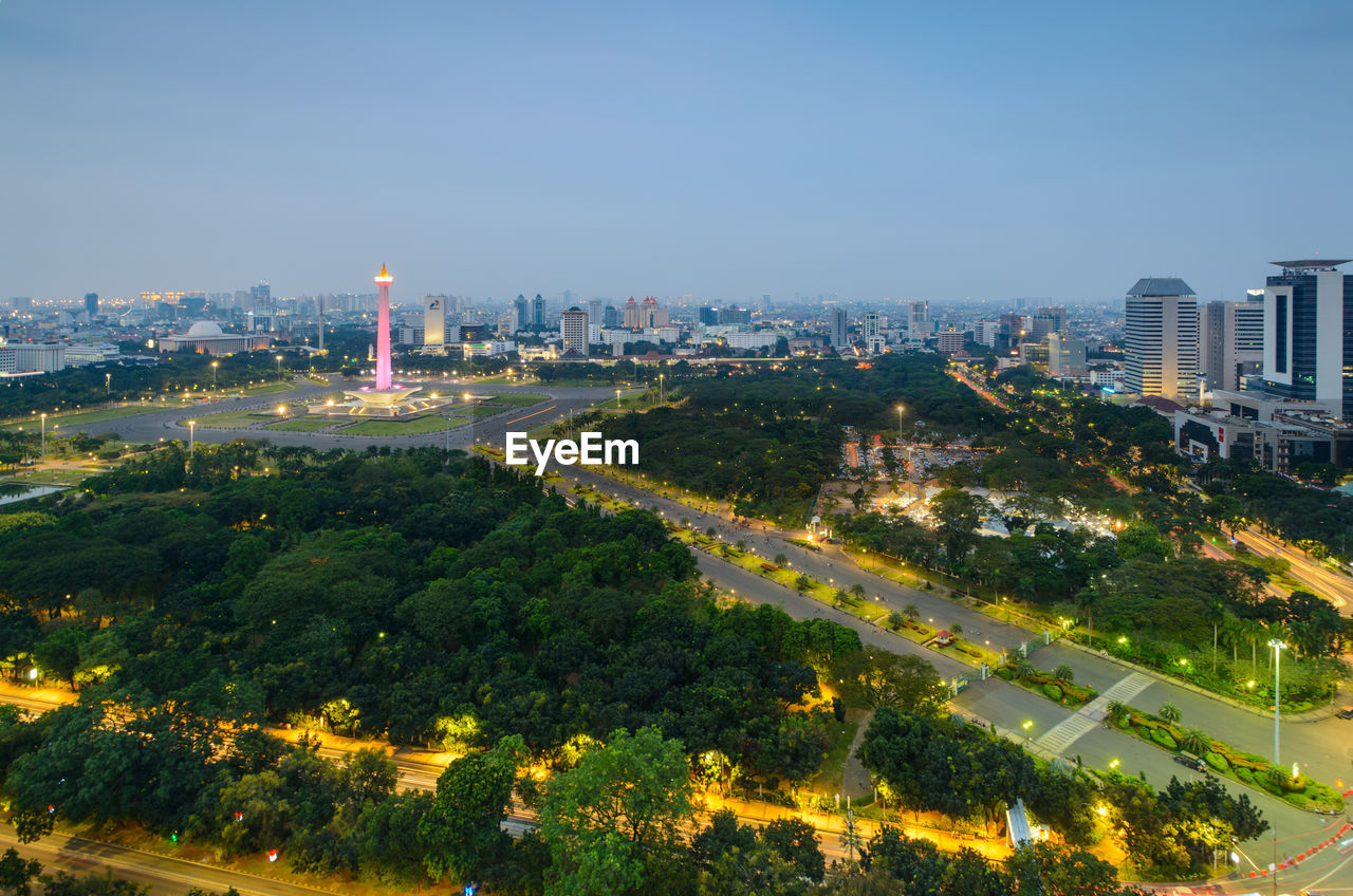 HIGH ANGLE VIEW OF TREES AND BUILDINGS AGAINST SKY