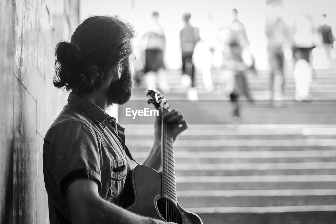 Street musician playing guitar