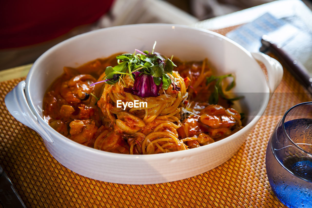 High angle view of spaghetti served on table