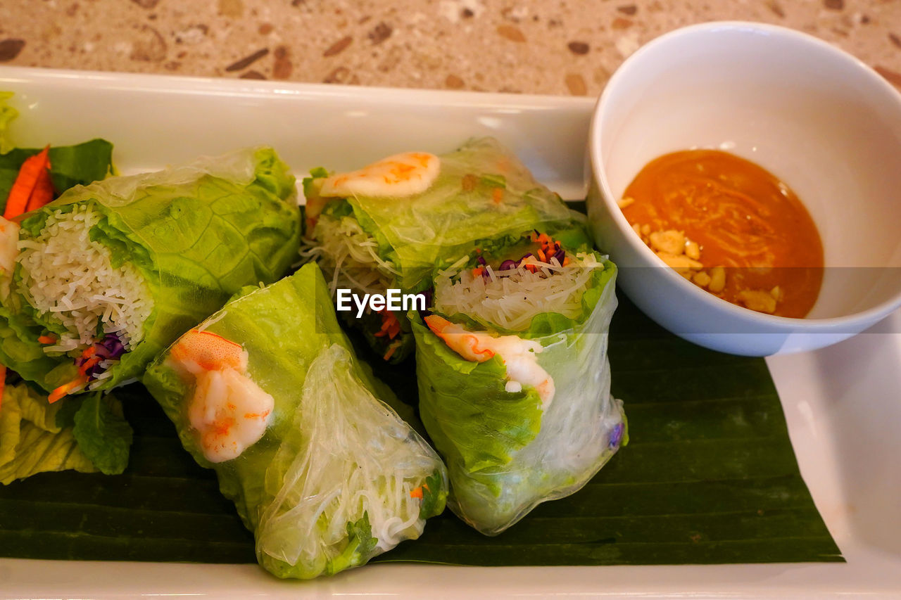 food and drink, food, healthy eating, dish, wellbeing, vegetable, freshness, spring roll, produce, fast food, asian food, meal, no people, cuisine, lunch, sandwich wrap, bowl, indoors, plate, condiment, sauce, close-up, fruit