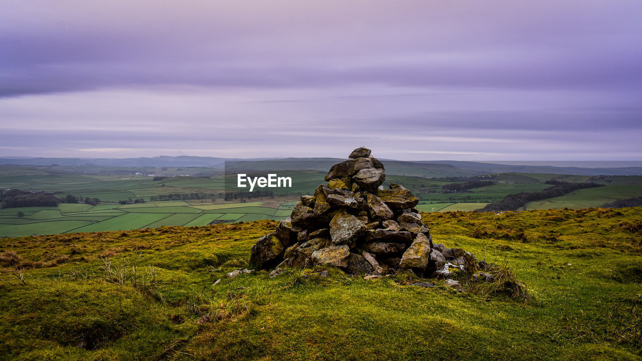 landscape, environment, sky, wilderness, mountain, nature, scenics - nature, cloud, land, beauty in nature, plant, grass, rock, outdoors, tranquility, no people, travel destinations, field, travel, terrain, non-urban scene, green, tranquil scene, plateau, rural scene, day