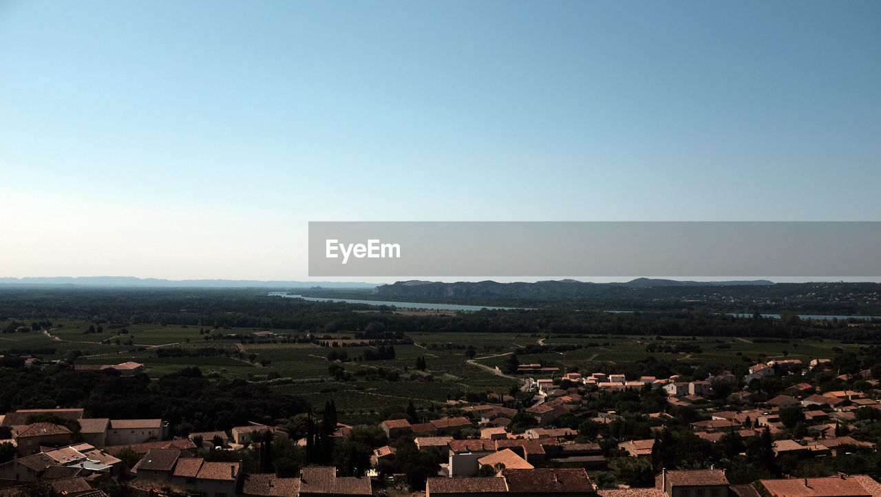 HIGH ANGLE SHOT OF TOWNSCAPE AGAINST CLEAR SKY