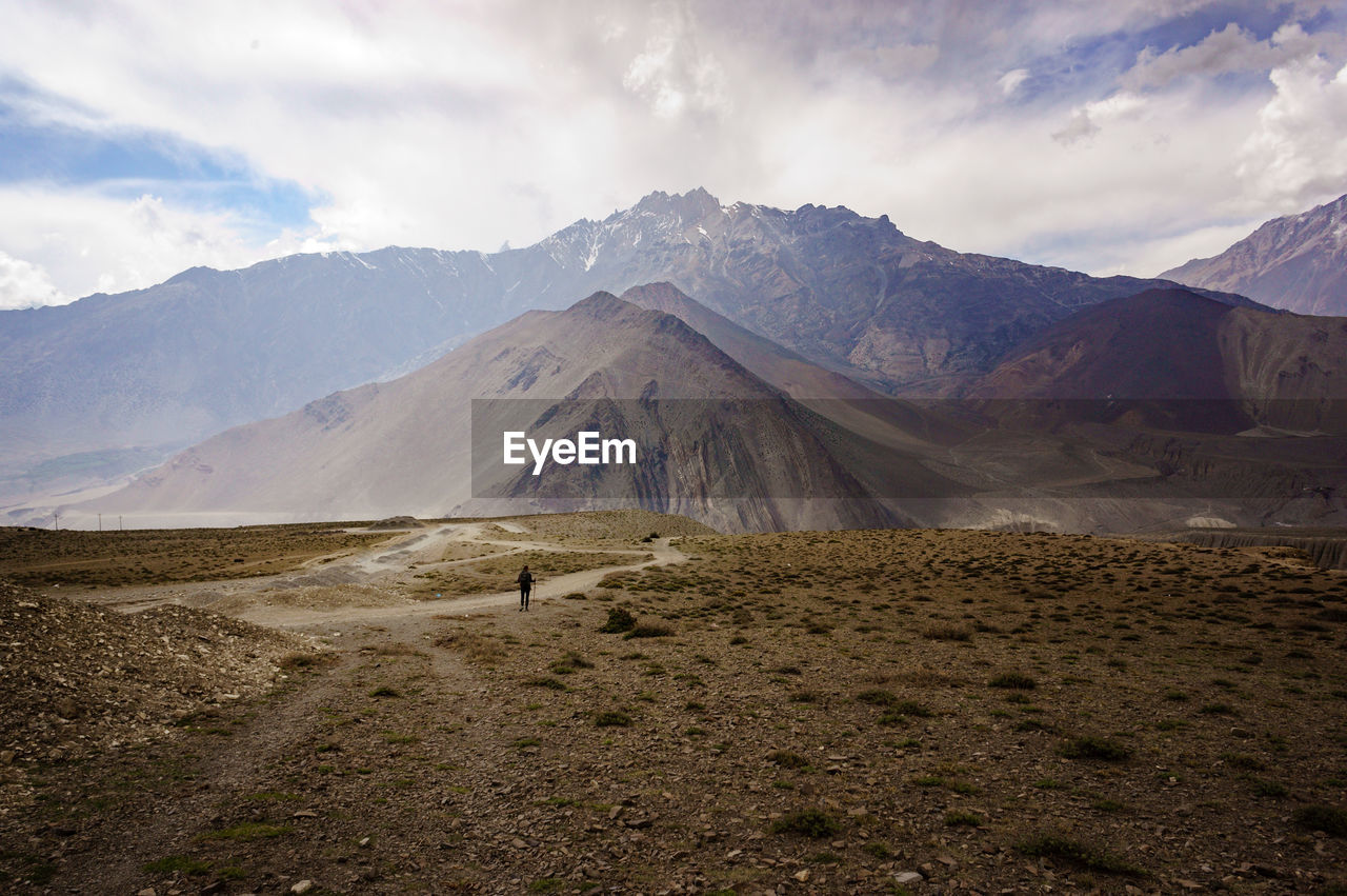 View of mountain range against cloudy sky