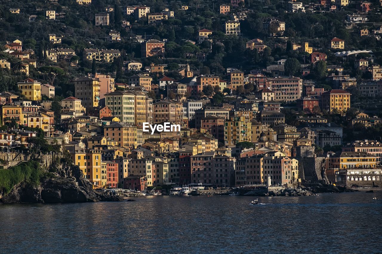 High angle view of buildings by sea