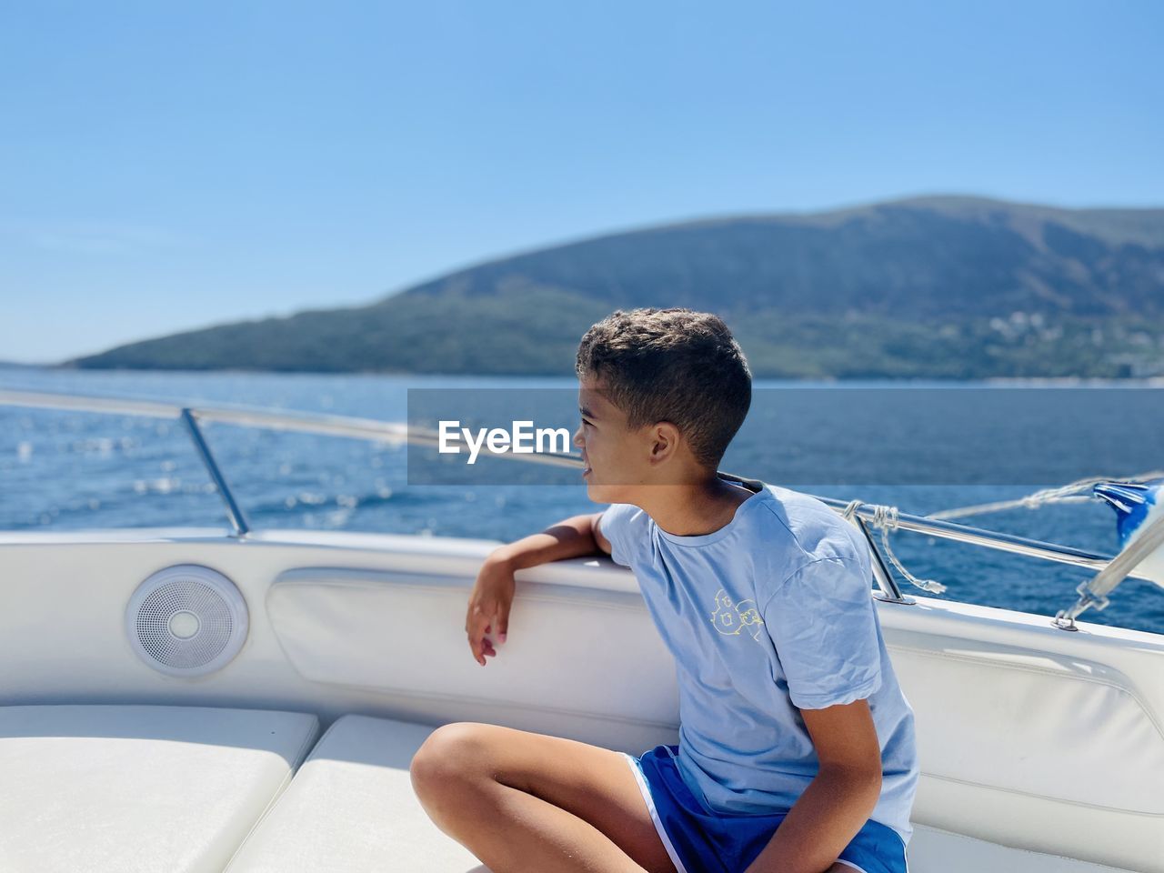 Side view of boy in speedboat 