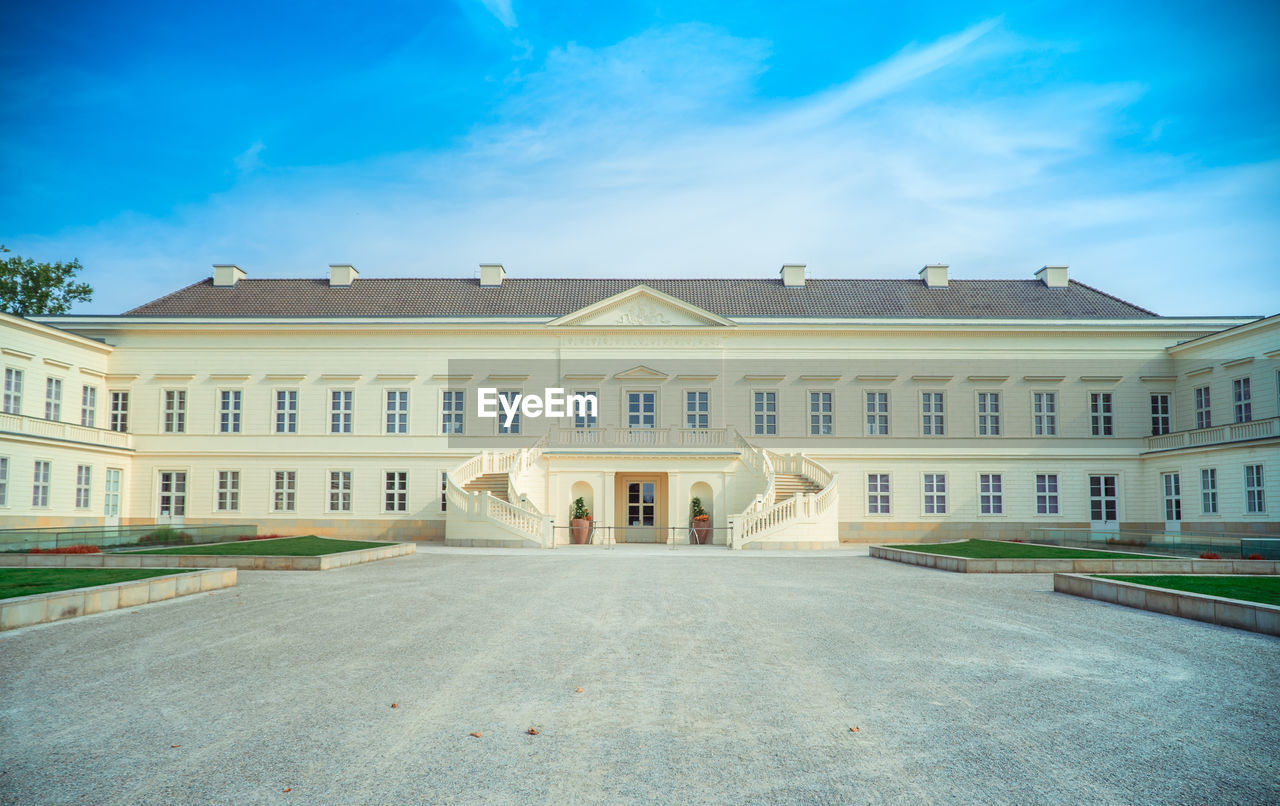 Facade of historic building against blue sky