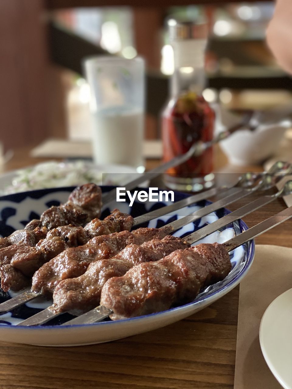 CLOSE-UP OF BREAD ON TABLE IN RESTAURANT