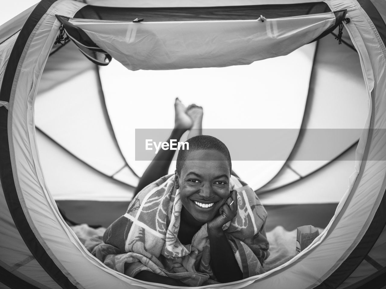 Portrait of smiling woman in tent