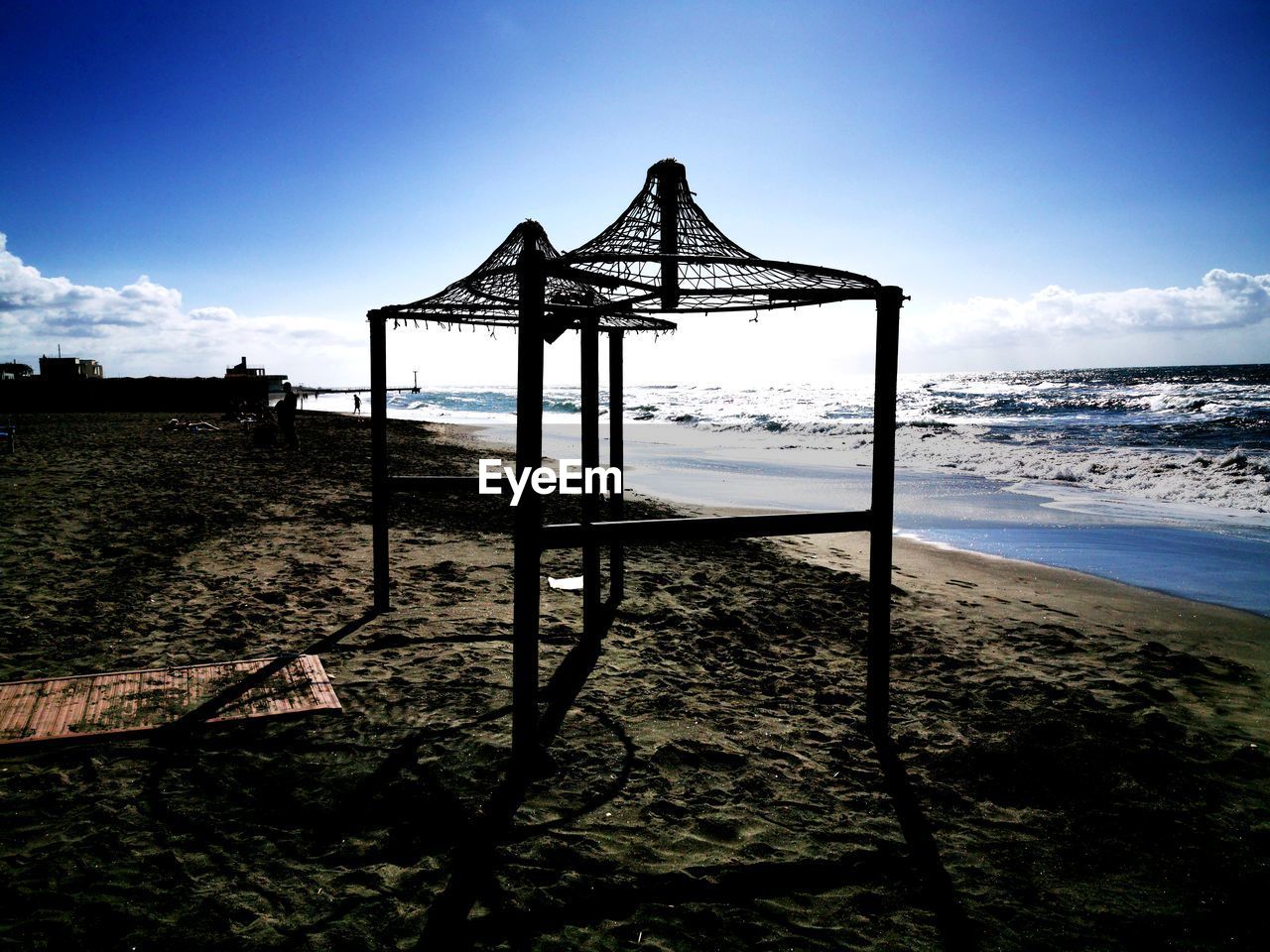 LIFEGUARD HUT ON SHORE AGAINST SKY