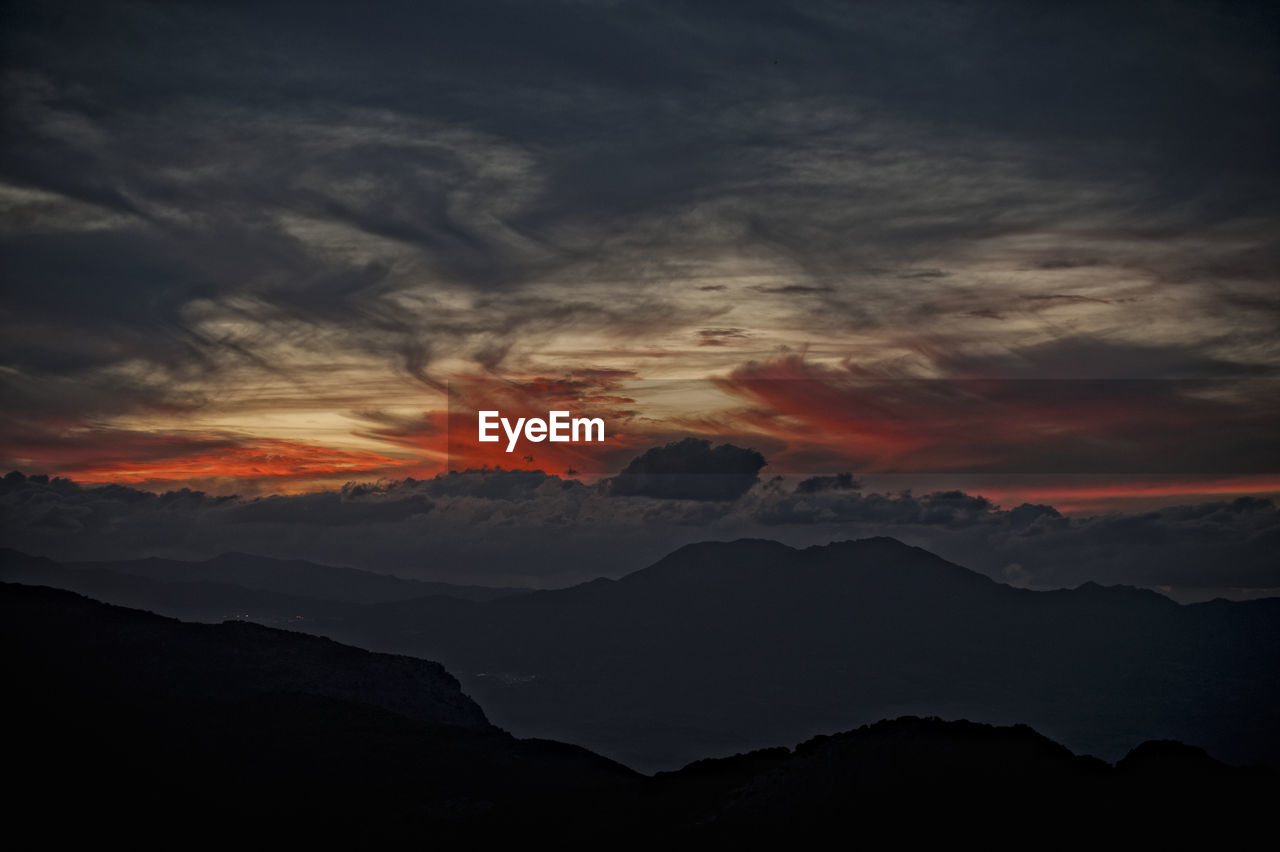 Scenic view of dramatic sky during sunset