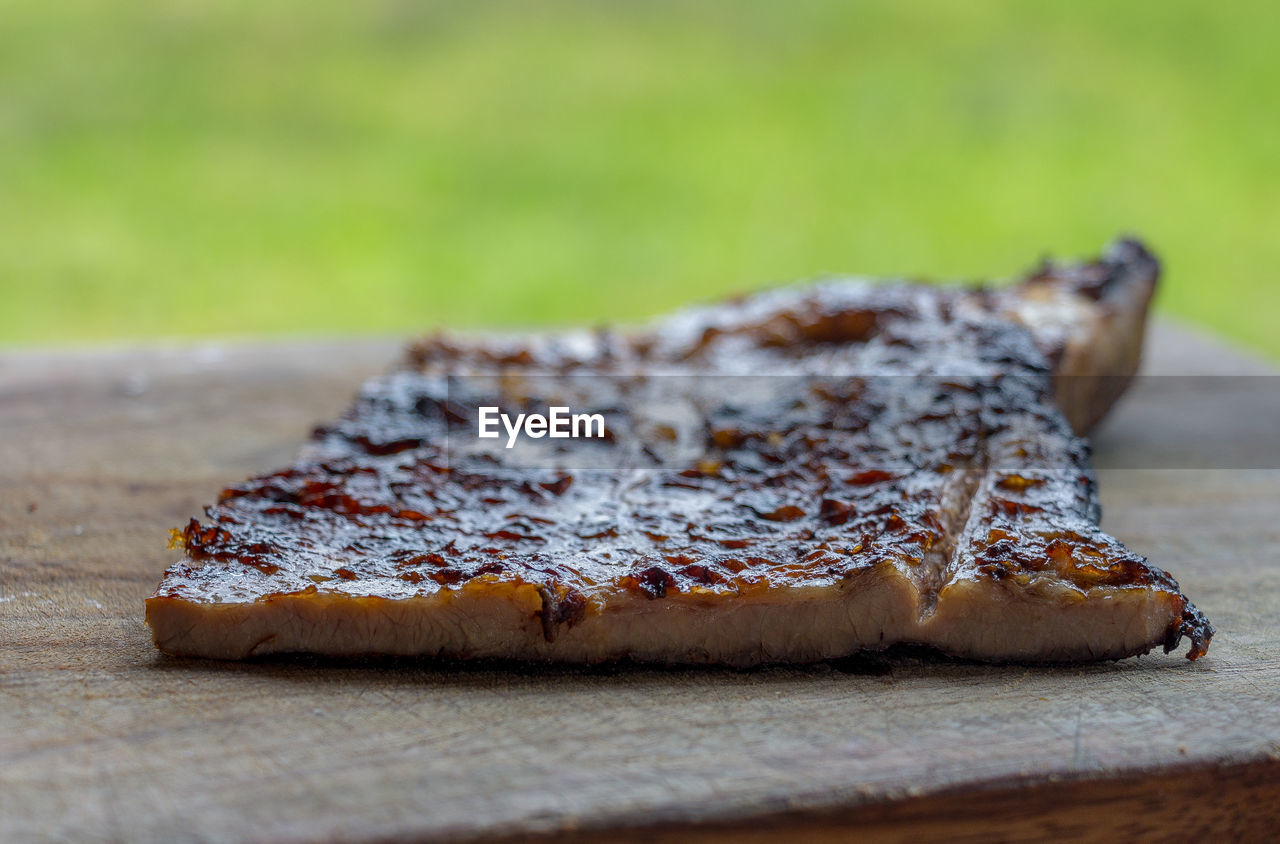 CLOSE-UP OF BREAD ON GROUND