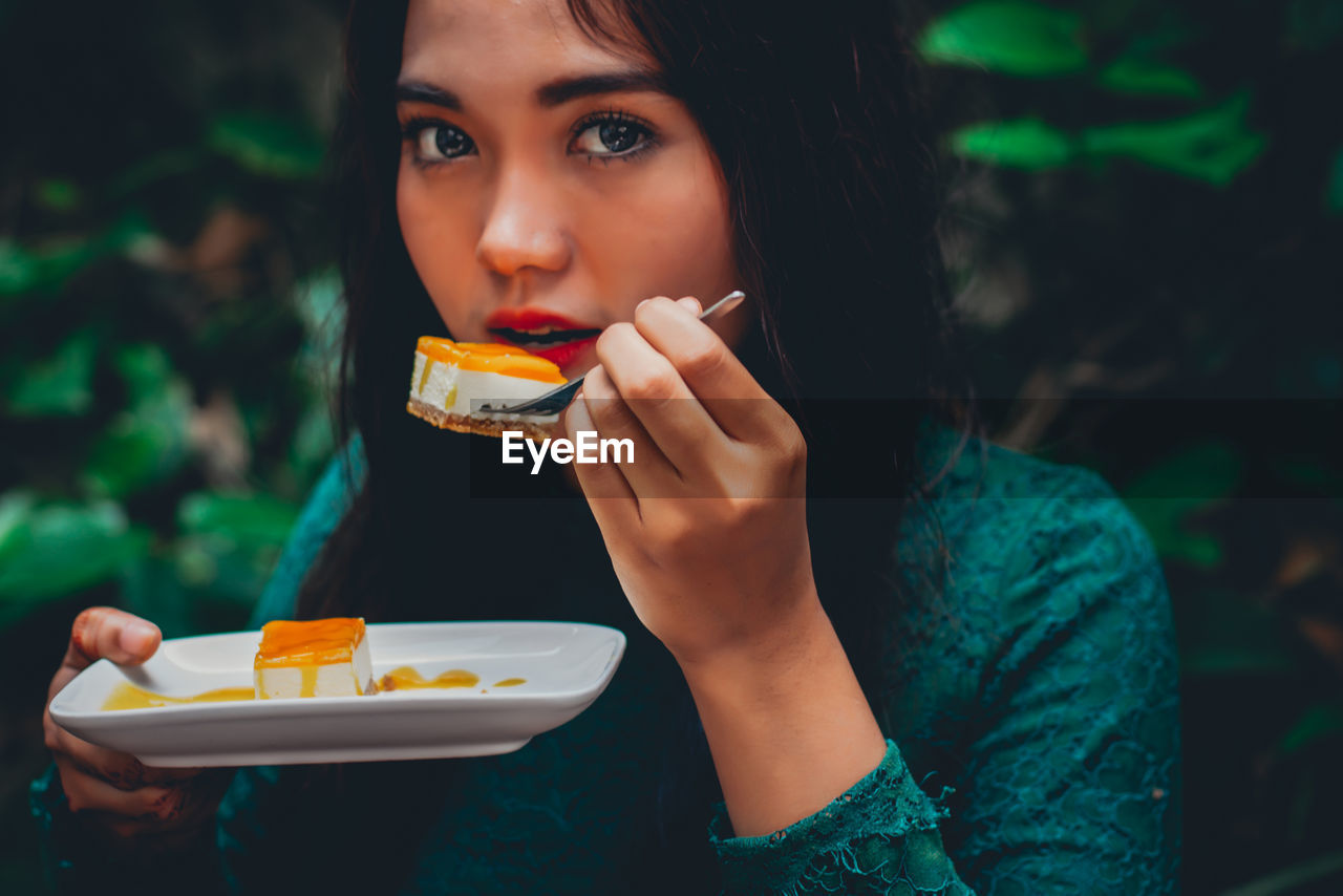 Woman having dessert at table