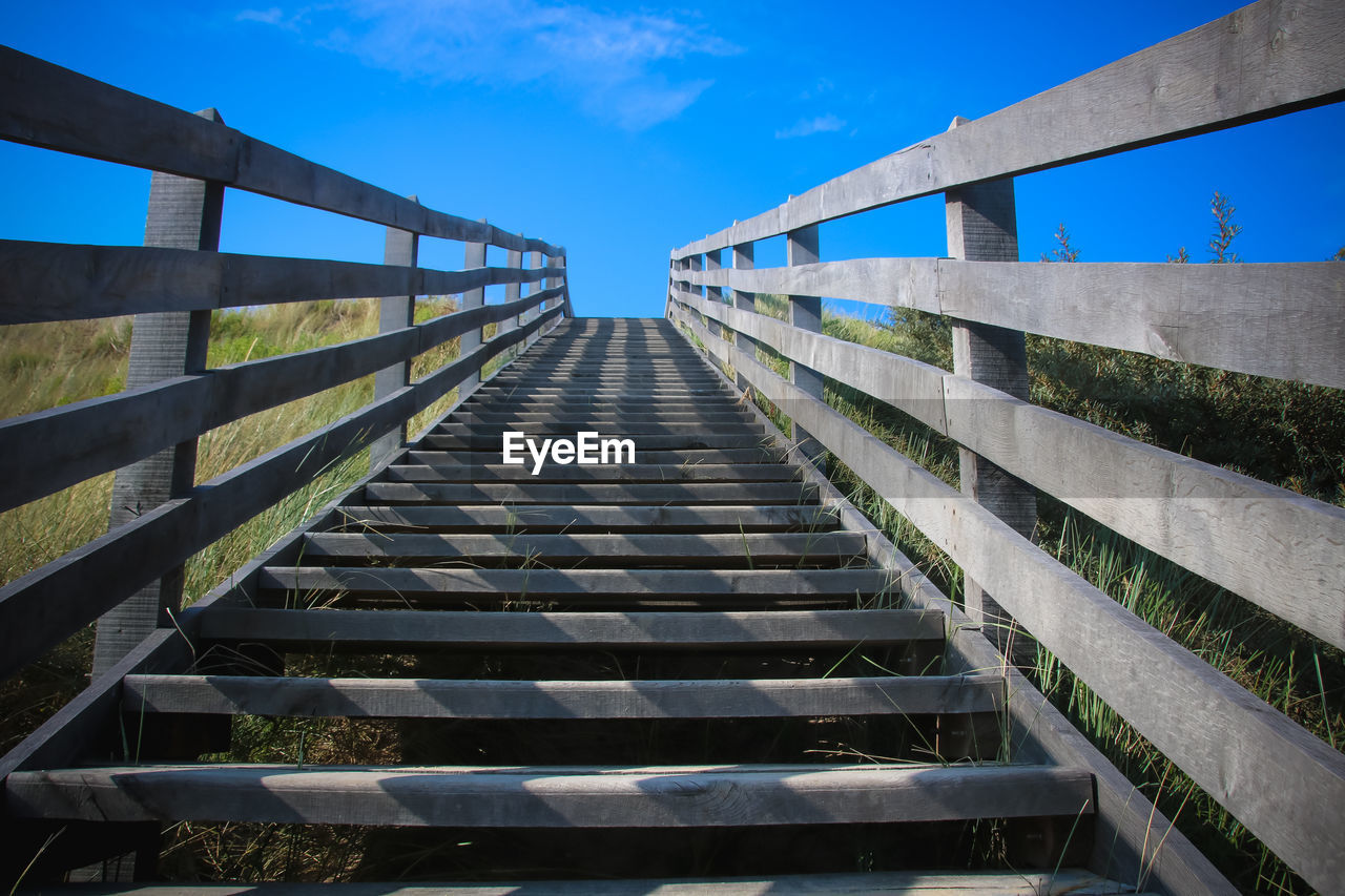 Low angle view of footbridge against sky in sangatte