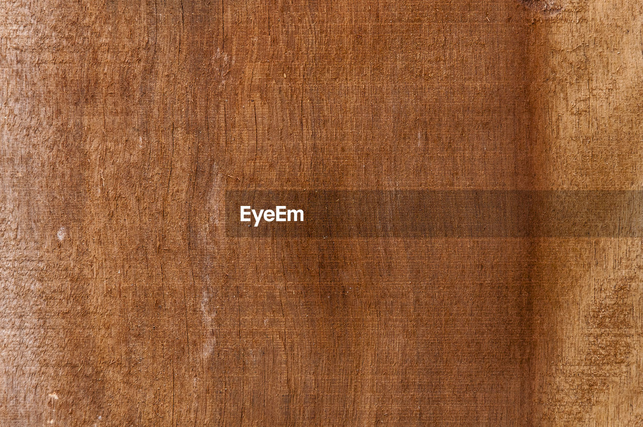 Full frame shot of brown wooden plank