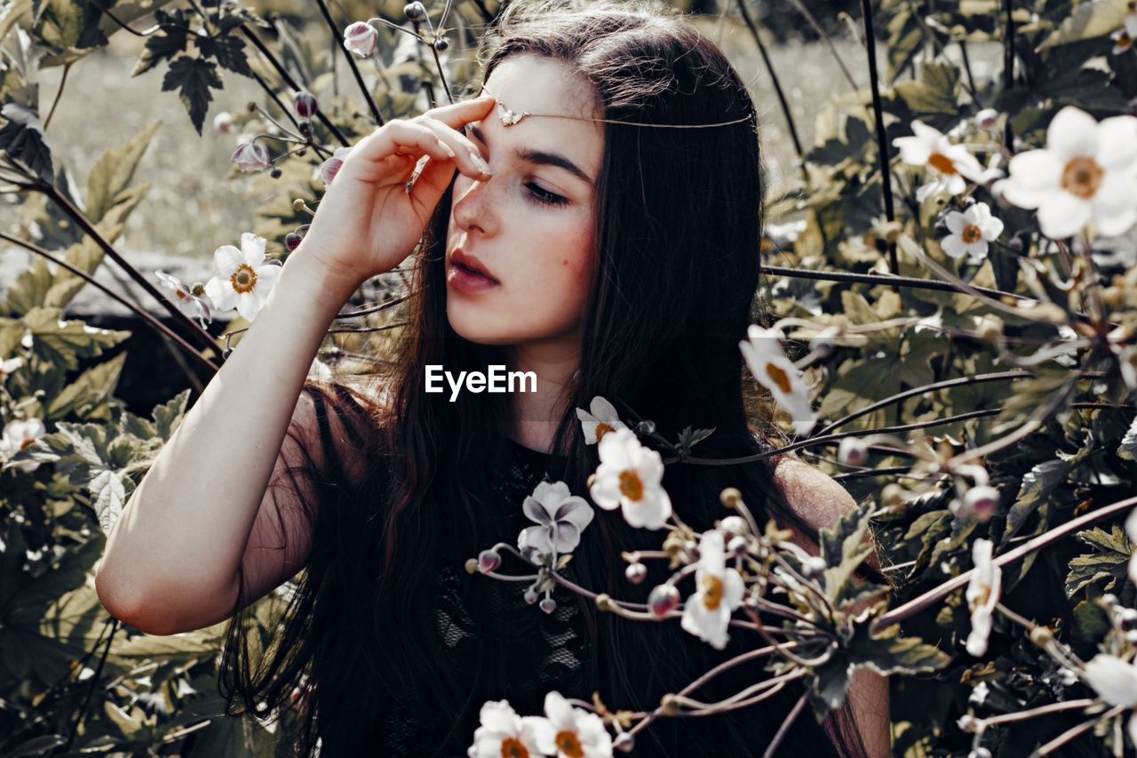 Attractive woman in flowers