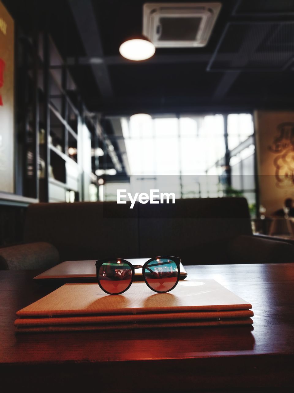 Sunglasses on table in restaurant
