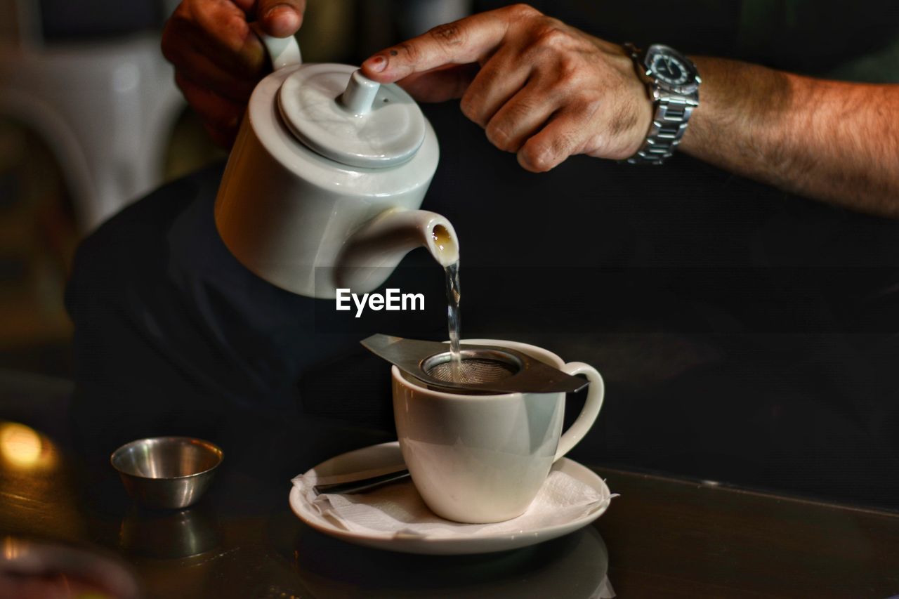 CLOSE-UP OF COFFEE CUP ON TABLE