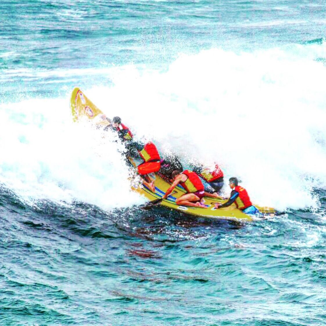 People on water sled at sea