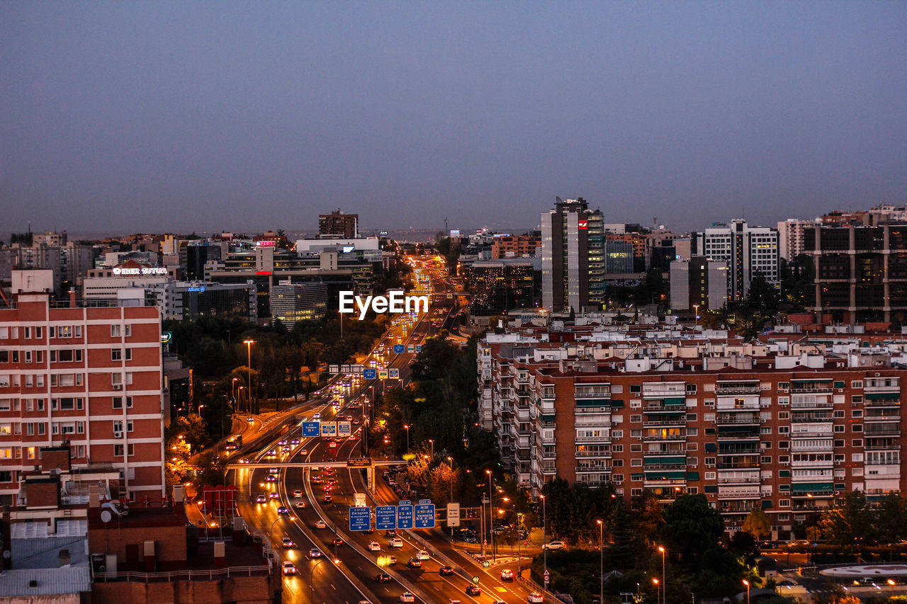 Cityscape against sky at dusk