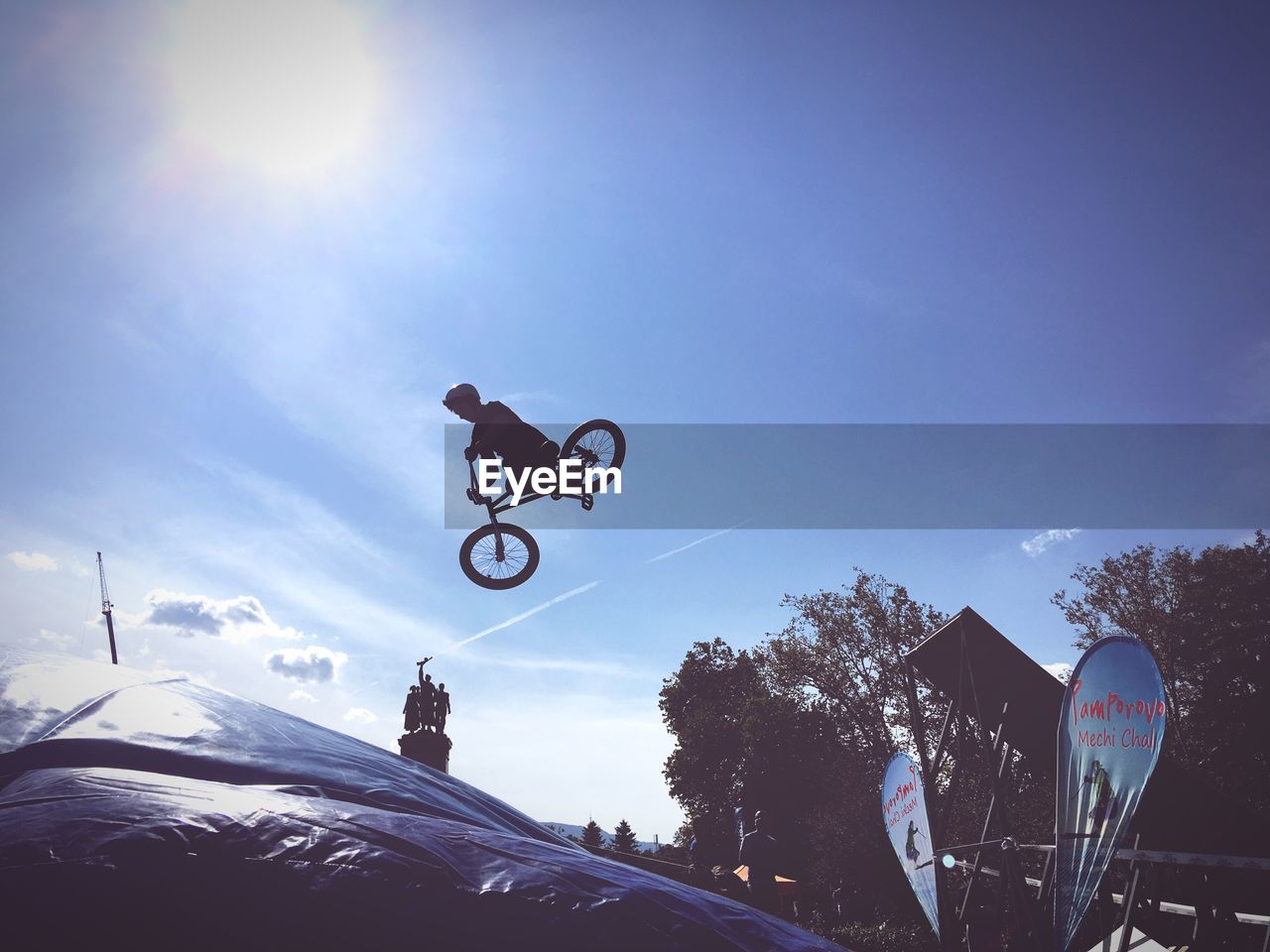 LOW ANGLE VIEW OF MAN JUMPING AT SKY