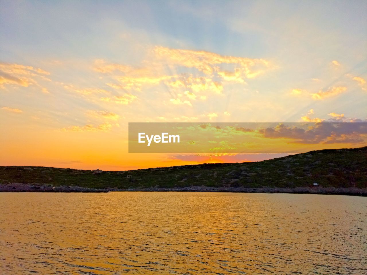 SCENIC VIEW OF SEA DURING SUNSET