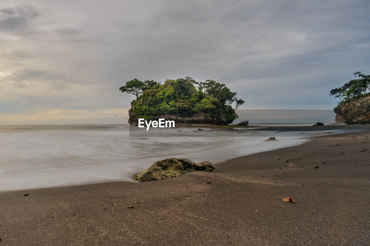 Scenic view of beach against sky