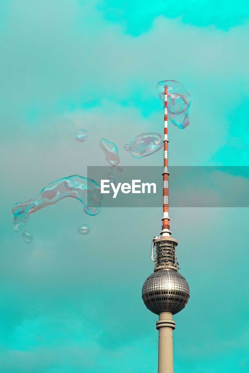 Communications tower against colored blue sky