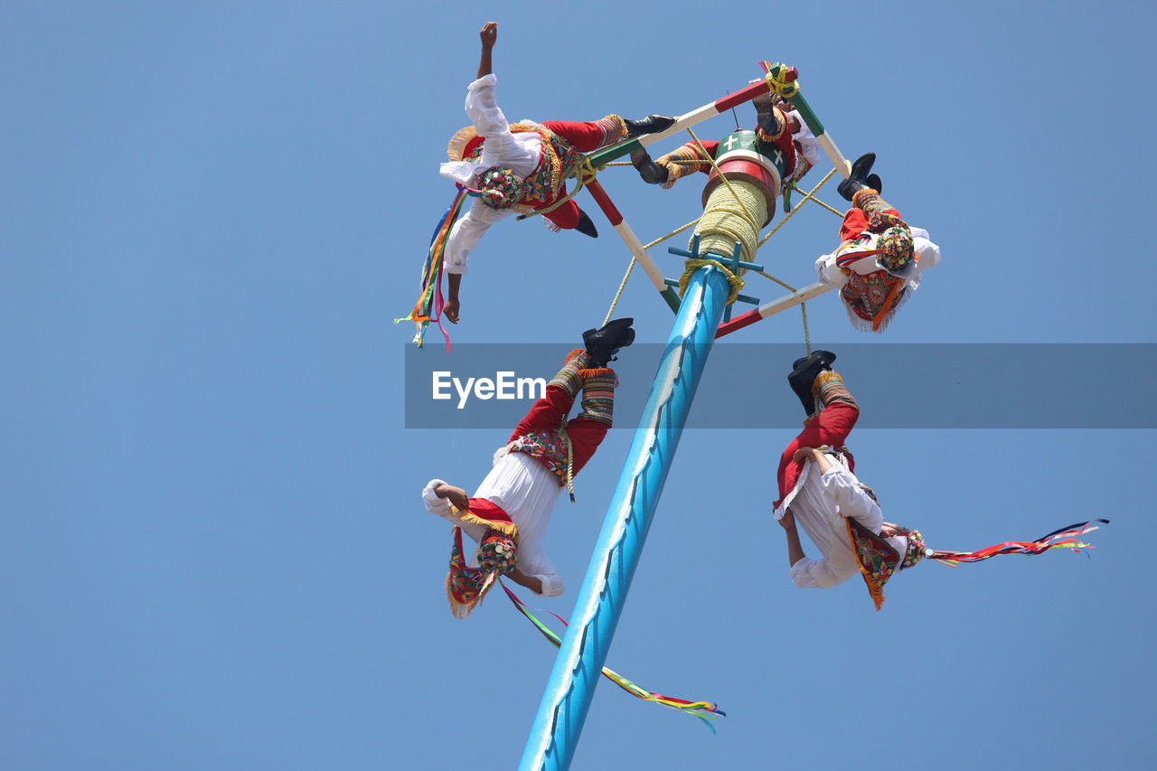 low angle view of kites against clear sky