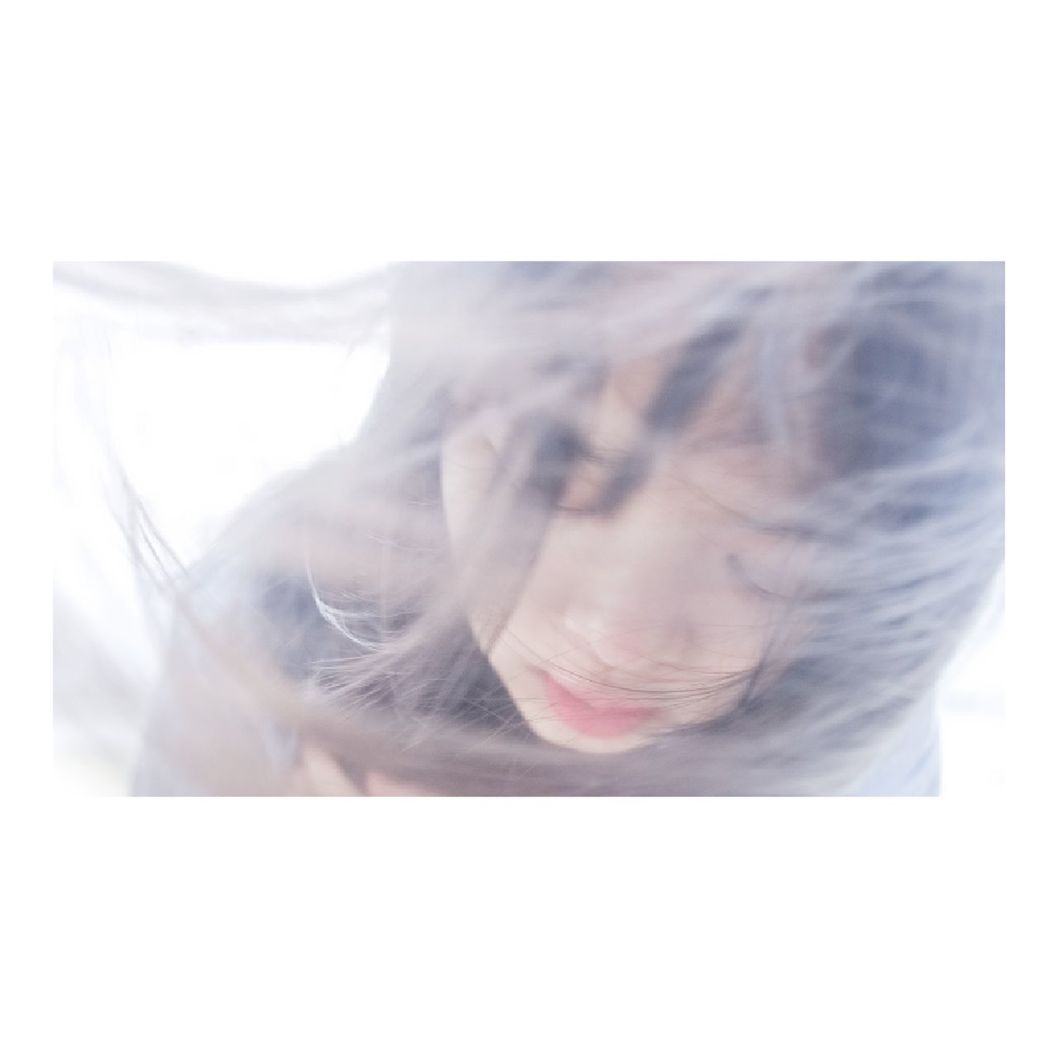 DOUBLE EXPOSURE IMAGE OF YOUNG WOMAN WITH WHITE BACKGROUND