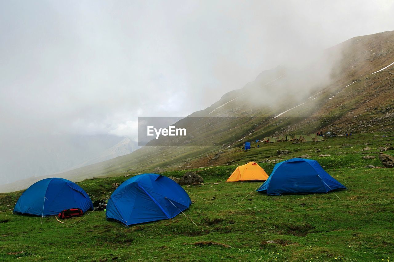 SCENIC VIEW OF TENT ON MOUNTAIN