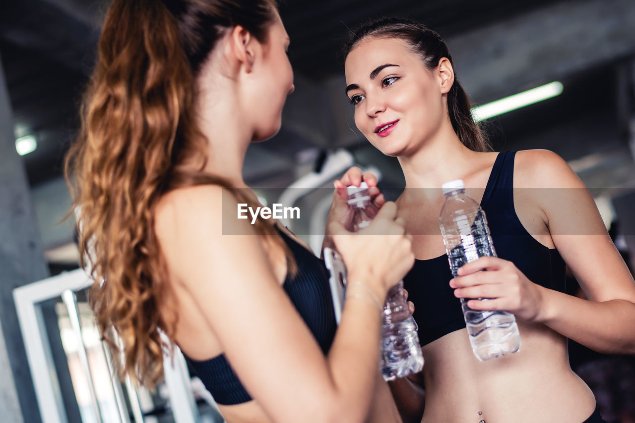 Smiling female standing in gym