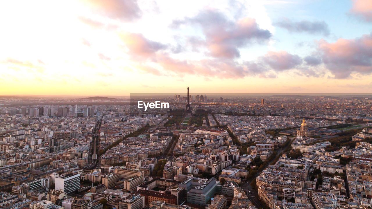 High angle view of cityscape against cloudy sky